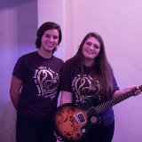 Lemoore's Suzy Montoya and Makayla Powell with autographed Les Paul guitar.